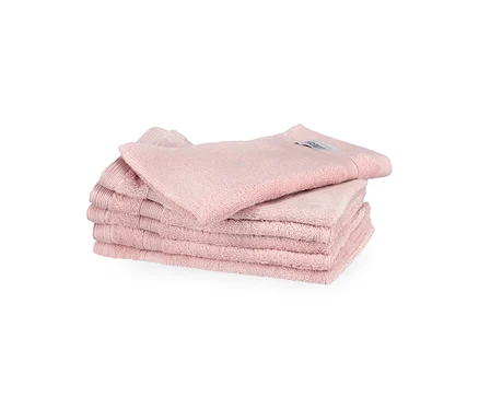 Stapel von sechs rosa SCHÖNER WOHNEN-Kollektion »Cuddly« Gästehandtüchern, ordentlich gefaltet, wobei ein Handtuch oben aufliegt.