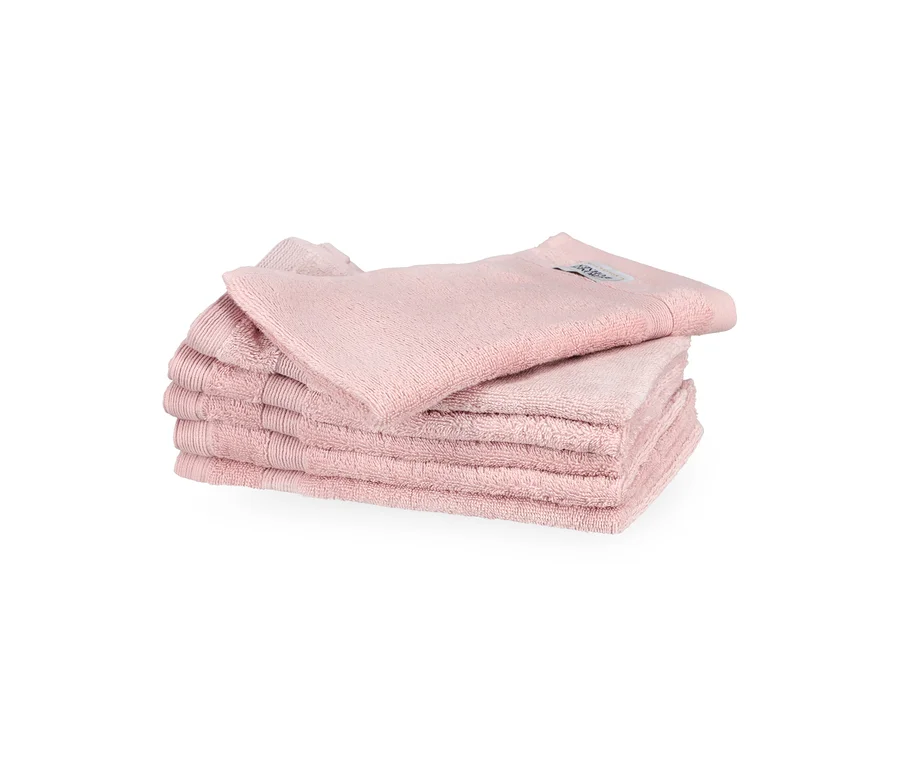Stapel von sechs rosa SCHÖNER WOHNEN-Kollektion »Cuddly« Gästehandtüchern, ordentlich gefaltet, wobei ein Handtuch oben aufliegt.