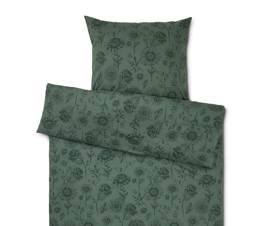 Grüne Bettwäsche mit Blumenmuster, inklusive Kissen und Bettdecke.