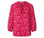 Rote Bluse mit rosa Blumenmuster und Quasten am Halsausschnitt.
