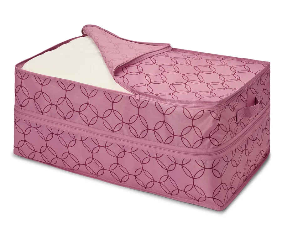 Rosa Aufbewahrungstasche mit Reißverschluss und Kreismuster, teilweise geöffnet, mit weißem Kissen darin.