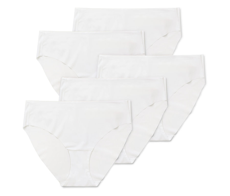 Mehrere weiße Damen Slips sind übereinander gestapelt.