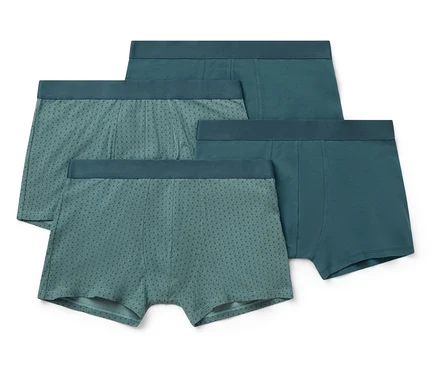 Vier Paar Herren-Boxershorts in verschiedenen Blautönen, einige davon mit Punktmuster.