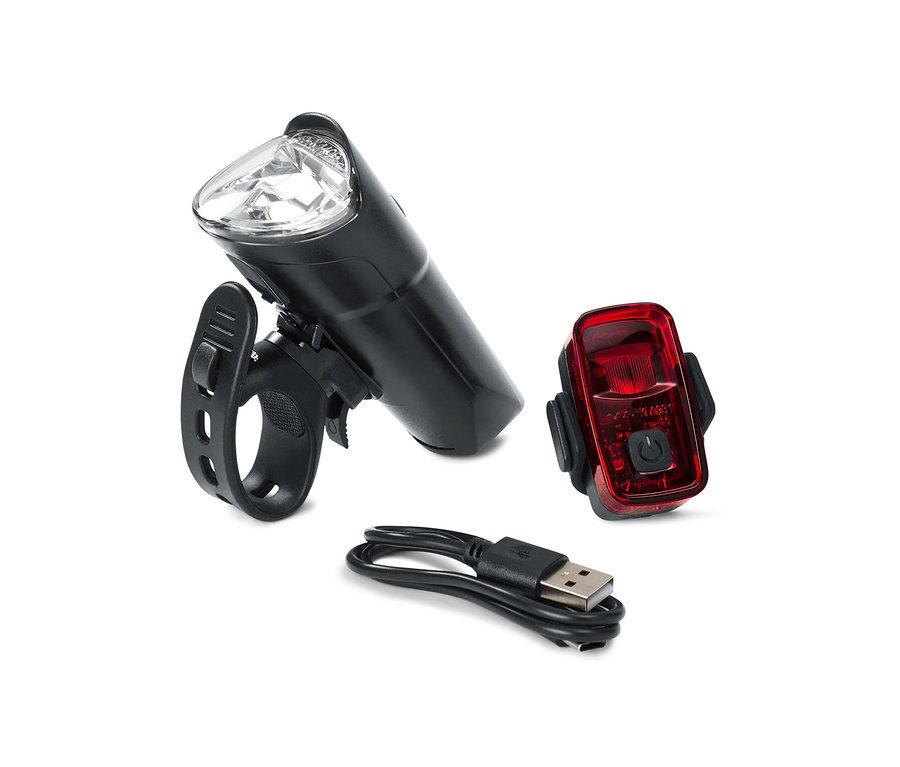 Das Fahrrad-Beleuchtungsset besteht aus einem weißen Frontlicht, einem roten Rücklicht und einem USB-Ladekabel.