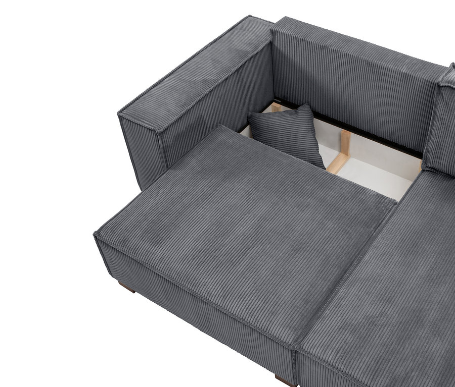 Nahaufnahme eines grauen Cord-Ecksofas mit ausziehbarer Ottomane, die Stauraum und ein Kissen zeigt.
