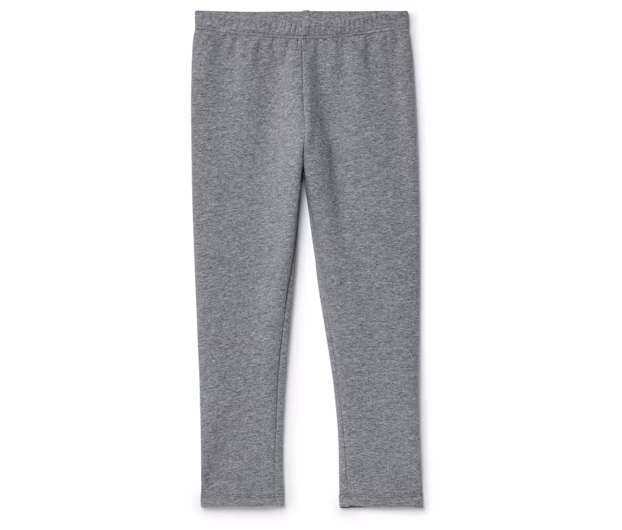 Graue Leggings liegen auf einem weißen Hintergrund.