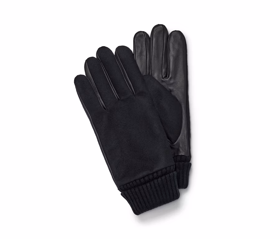 Zwei schwarze Lederhandschuhe liegen auf einem weißen Hintergrund.
