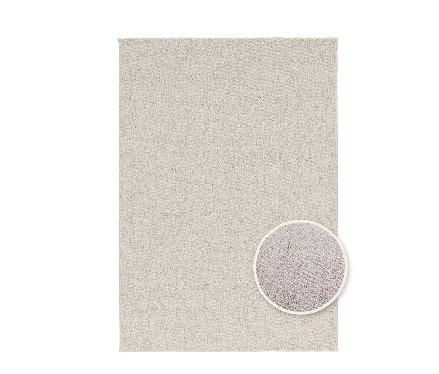 Ein creme-anthrazitfarbener Teppich "Daisy" mit einer Detailaufnahme der Textur.