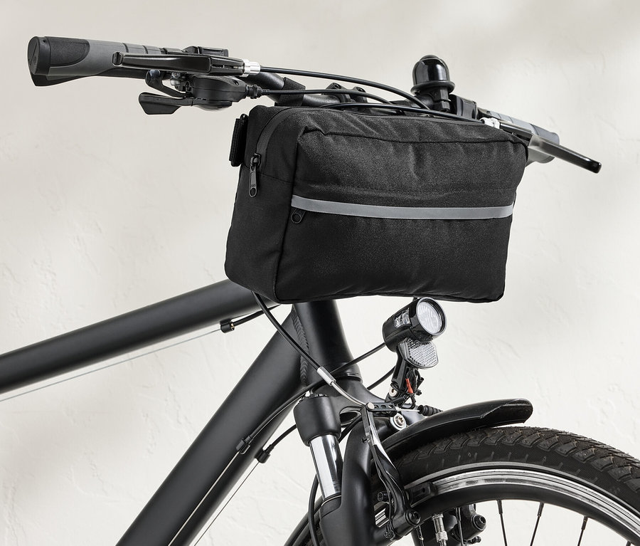 Eine schwarze 2-in-1-Lenkertasche an einem schwarzen Fahrradlenker.