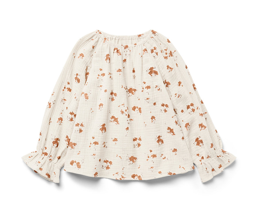 Eine Kinder-Musselin-Bluse mit langen Ärmeln und braunem Blumendruck.