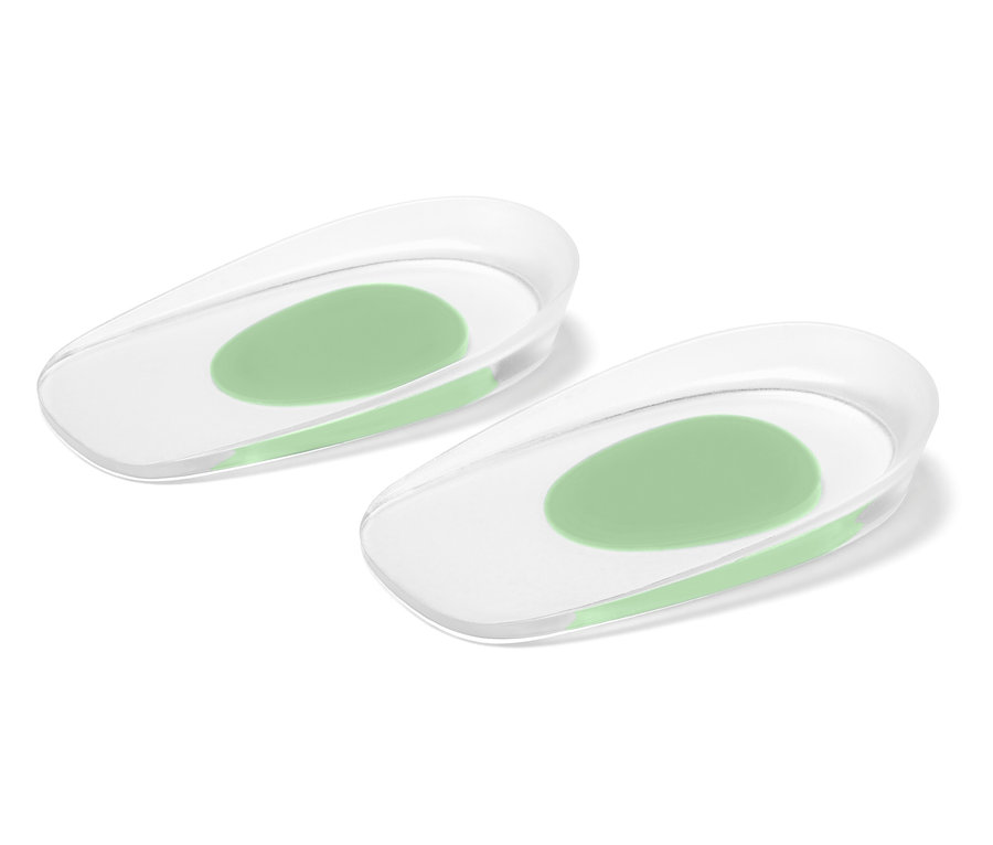 Zwei transparente Gel-Fersenpolster mit hellgrünen Gel-Einsätzen in der Mitte.