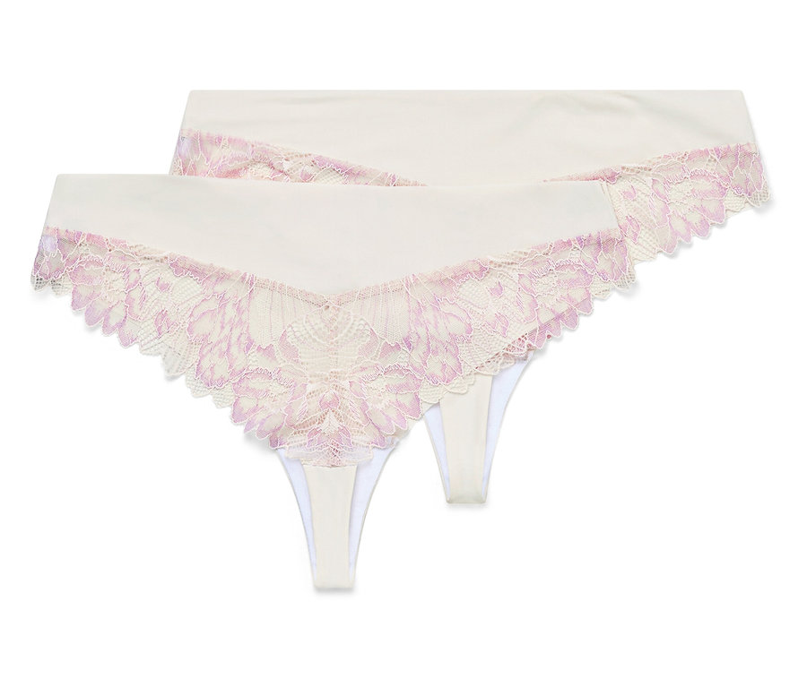 Zwei weiße Strings mit rosa Spitze liegen übereinander.