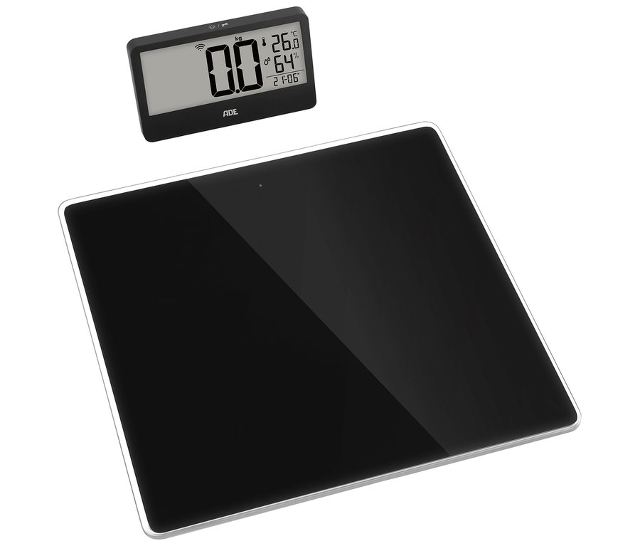 Schwarze digitale Personenwaage mit separatem Display, das 0,0 kg, 26,0 °C und 64 % anzeigt.