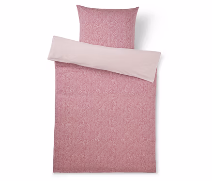 Rosa Bettwäsche-Set mit gemustertem Bettbezug und Kissenbezug, mit einem dunkleren rosa Blattmuster auf einer Seite und einer einfarbigen hellrosa Rückseite.