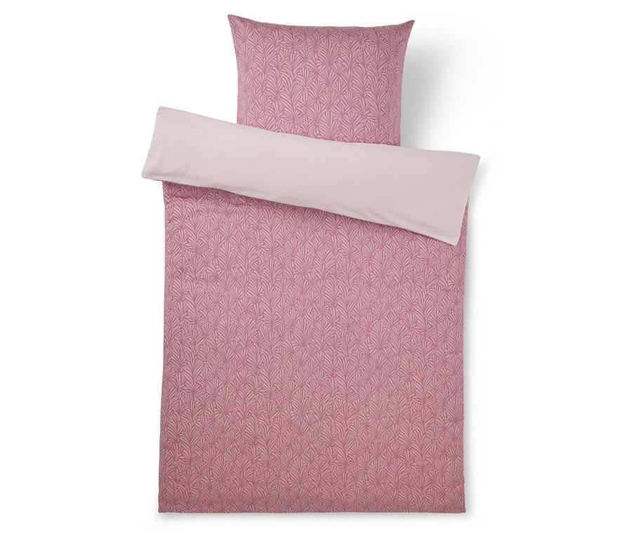 Rosa Bettwäsche-Set mit gemustertem Bettbezug und Kissenbezug, mit einem dunkleren rosa Blattmuster auf einer Seite und einer einfarbigen hellrosa Rückseite.