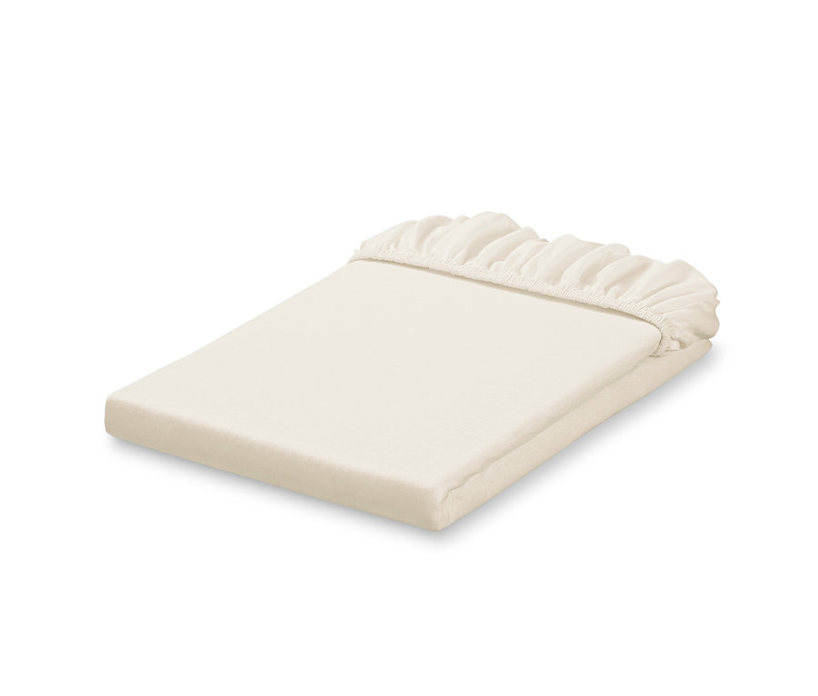 Beige Jersey-Spannbettlaken in Übergröße, gefaltet übereinander.