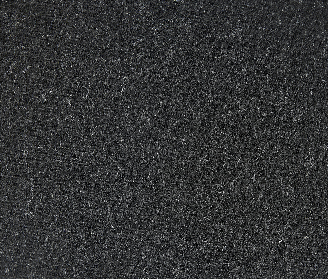 Nahaufnahme einer grauen Textiloberfläche.