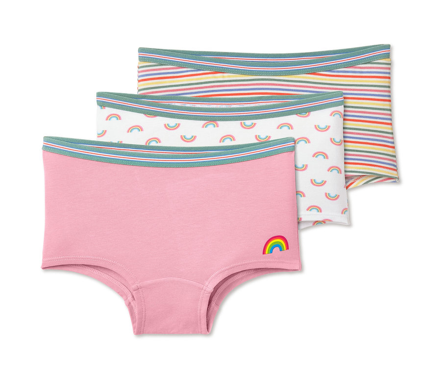 Drei Pantys: Eine rosafarbene mit Regenbogen, eine weiße mit Regenbogen und eine gestreifte.