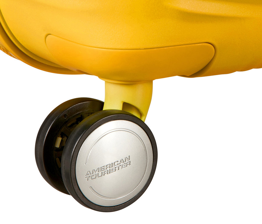 Detailansicht eines goldenen American Tourister Hartschalen-Koffers »Soundbox« mit Rollen.