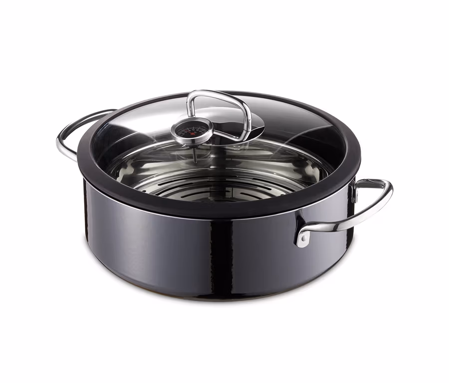 Ein schwarzer, runder Silit-Dampfgarer Ecompact Professional mit transparentem Deckel.