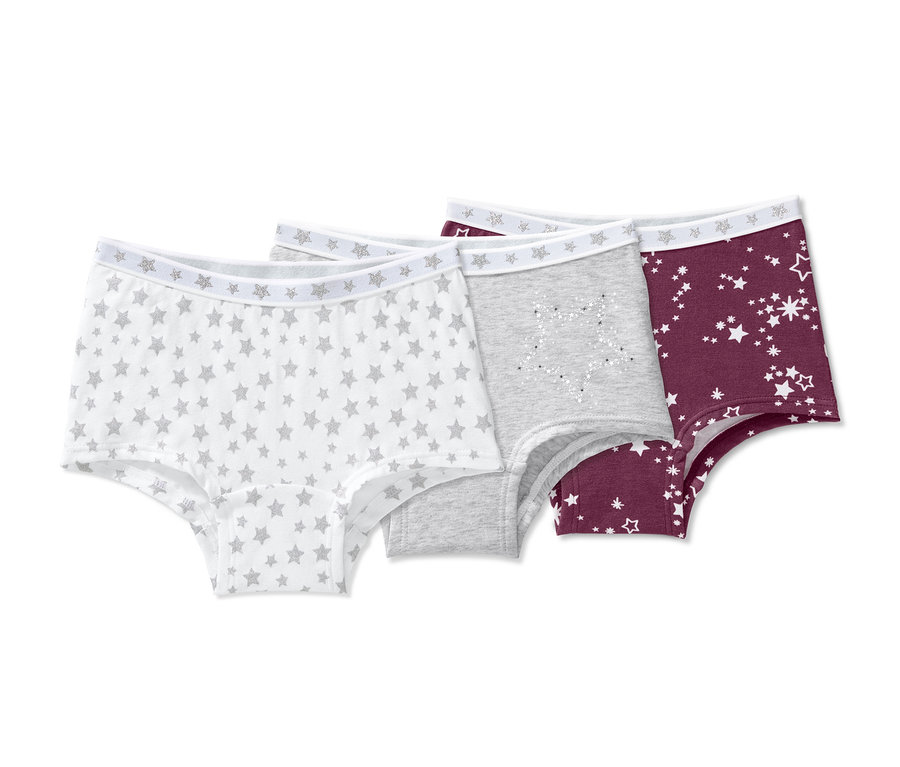 Drei Pantys: Weiß mit Sternen, Grau und Burgunderrot mit Sternen.