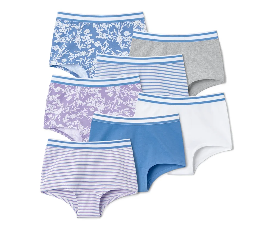 Sieben Mädchen-Pantys in verschiedenen Farben und Mustern.