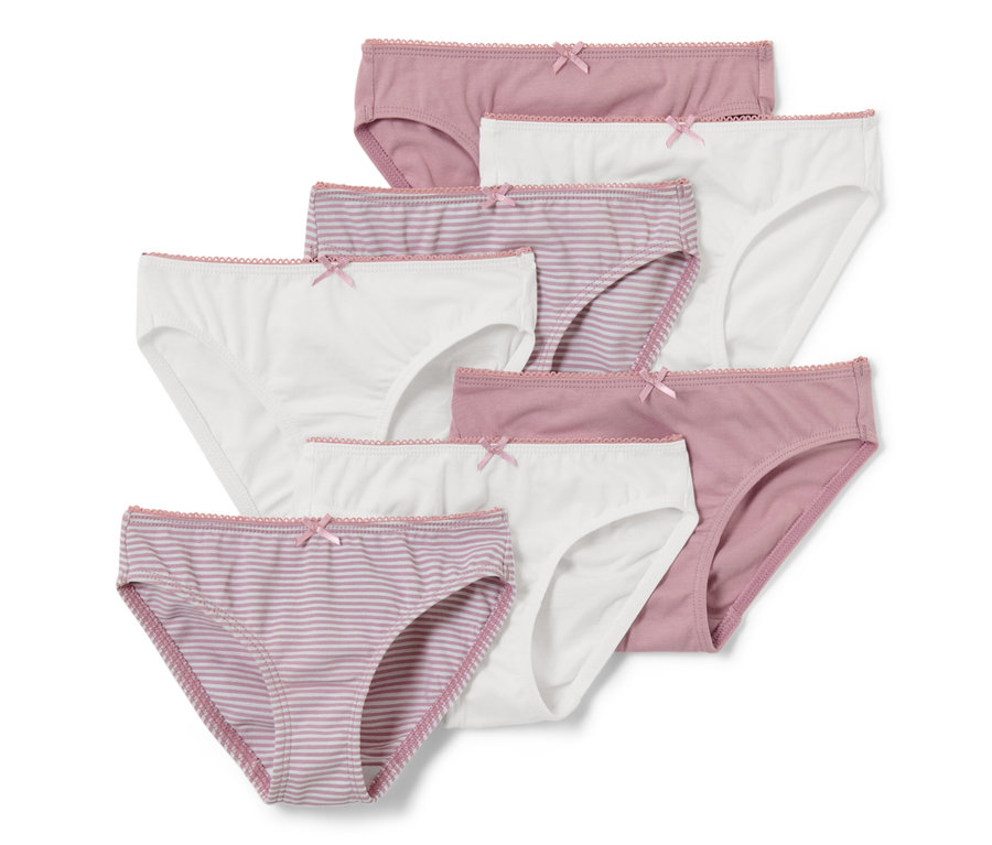 Sieben Kinder-Slips in Weiß, Rosa und Lila-Weiß gestreift mit Schleifen.