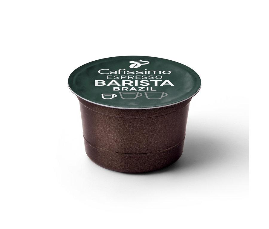 Eine braune Cafissimo BARISTA Espresso Brasil Kaffeekapsel mit dunkelgrünem Deckel. Auf dem Deckel stehen der Schriftzug 'Cafissimo ESPRESSO BARISTA BRAZIL' und ein Tchibo Logo mit drei Tassensymbolen.