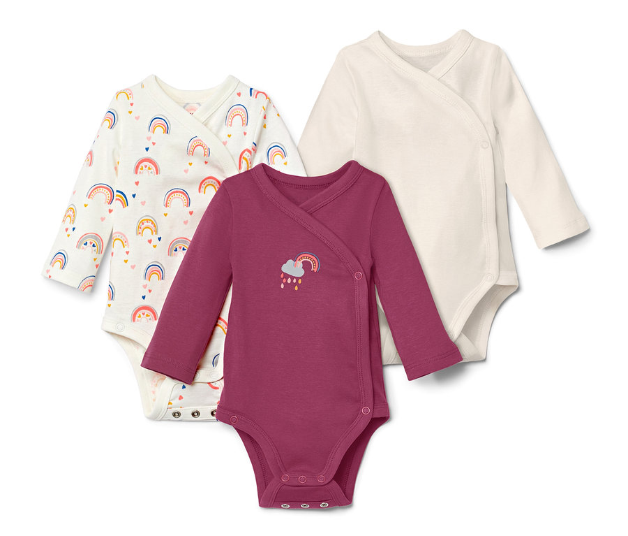 Drei Langarmbodys mit Regenbogenmuster.