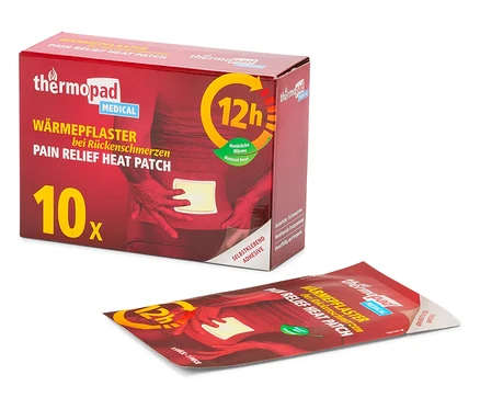 Eine Packung Thermopad Wärmepflaster und ein einzelnes Wärmepflaster sind auf einem weißen Hintergrund zu sehen.