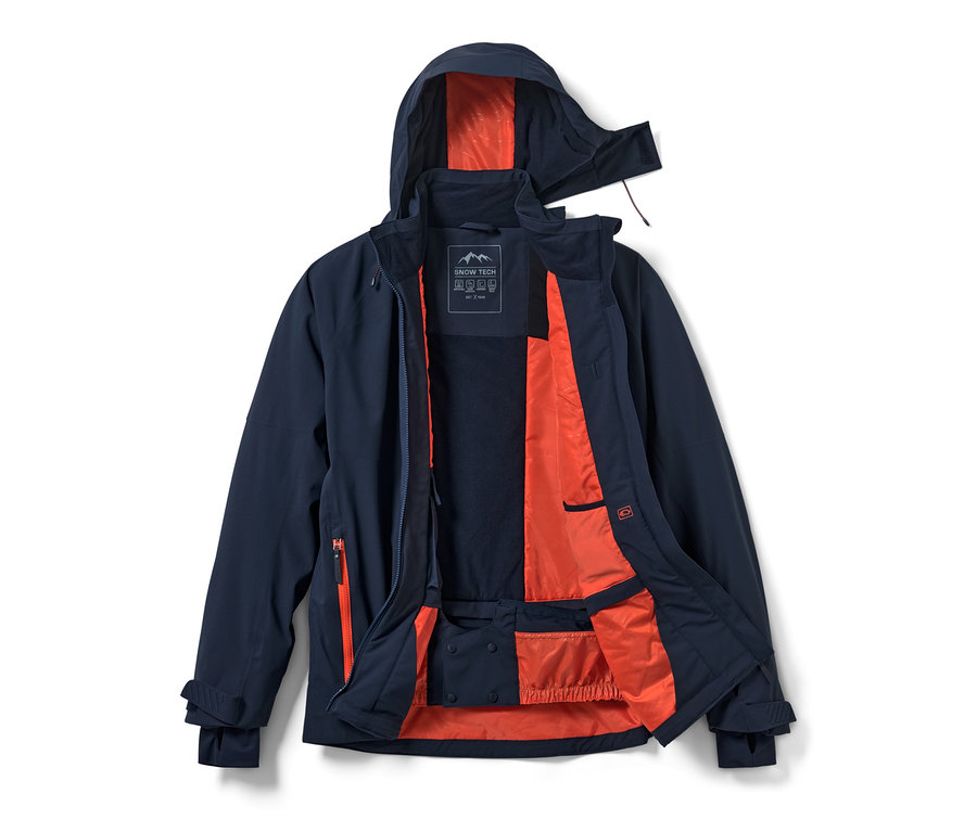 Geöffnete marineblaue High-Tech-Skijacke mit orangefarbenem Futter.