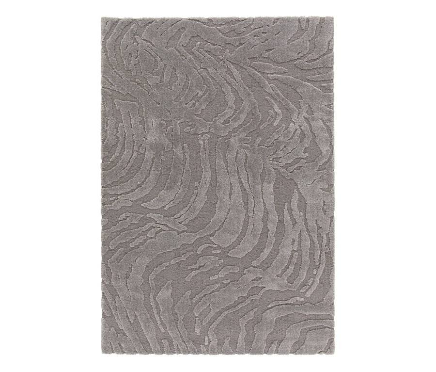Detailansicht eines grauen Teppichs »Cosmo« Waves mit gewelltem Muster.
