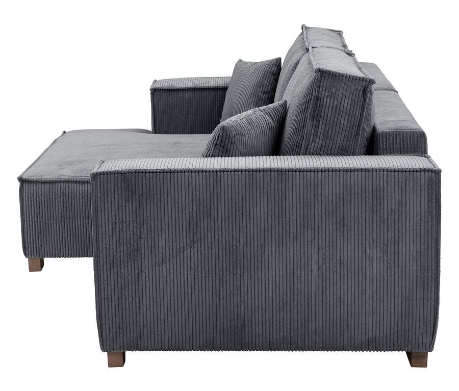 Graues Cordsofa mit Ottomane und losen Kissen.