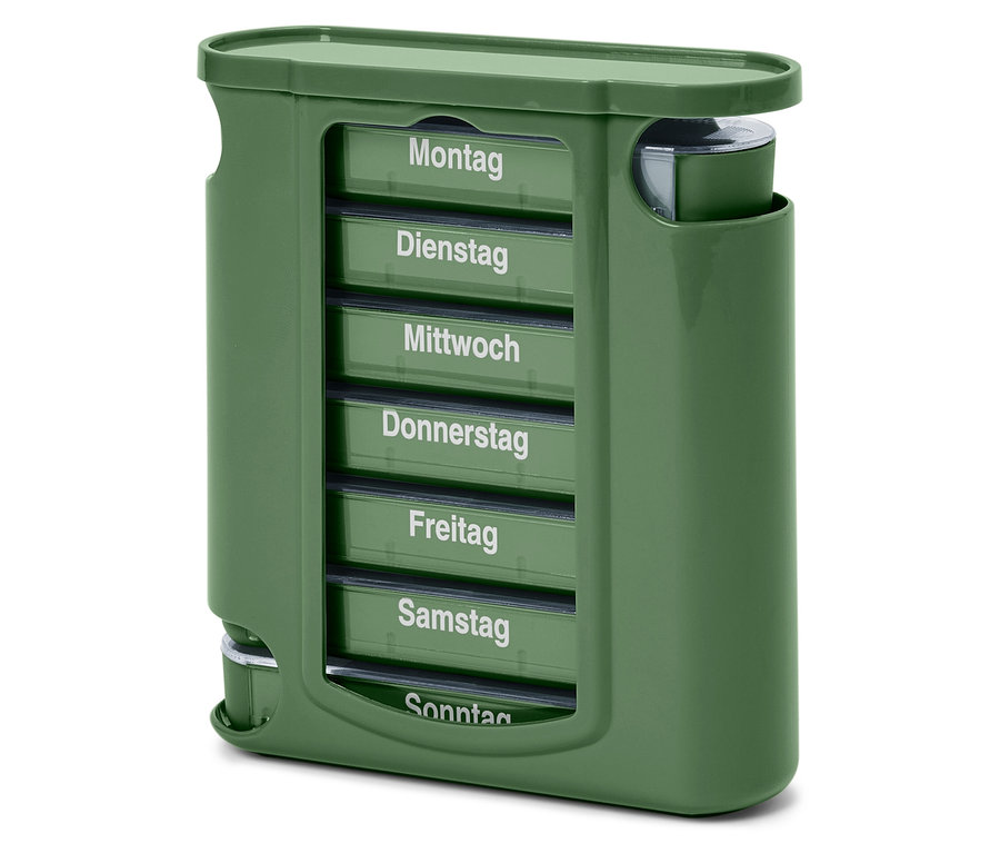 Ein grüner Pillen-Organizer mit Fächern für jeden Wochentag, beschriftet von Montag bis Sonntag.