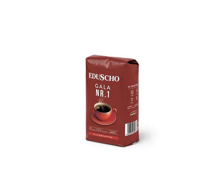 Eine Packung EDUSCHO Gala Nr. 1 Ganze Bohne mit einer Tasse Kaffee.