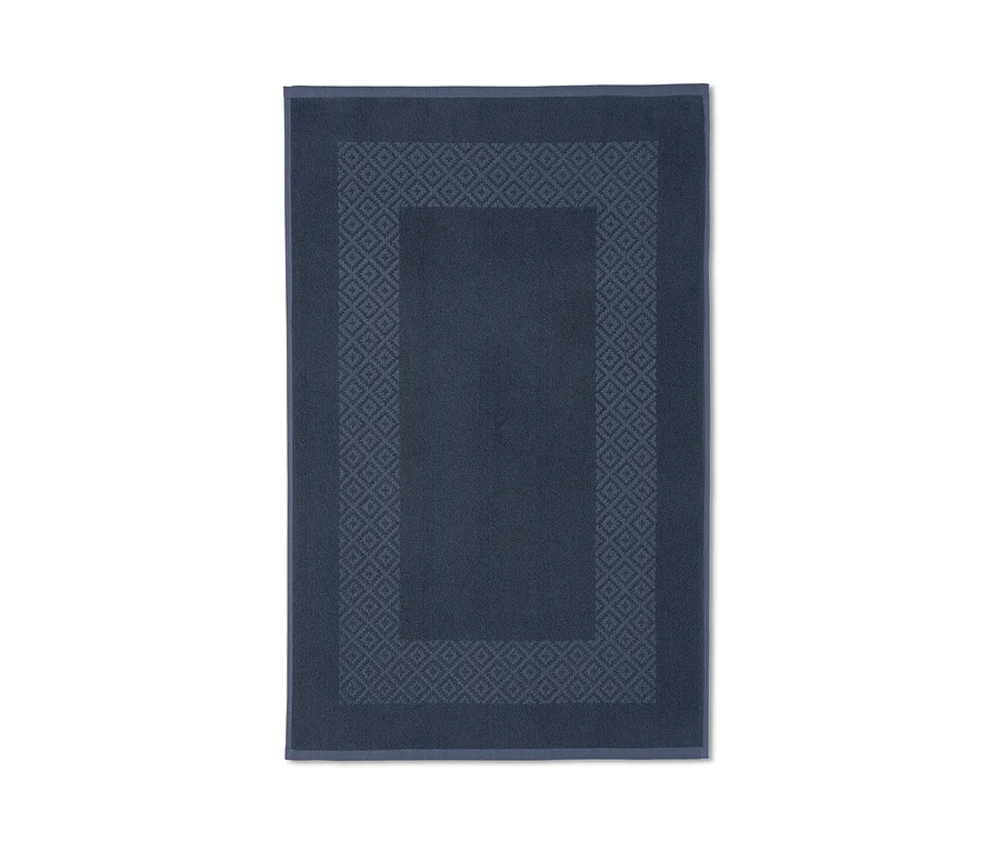 Blauer Wende-Duschvorleger mit geometrischem Muster.