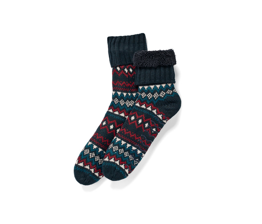 Zwei dunkelblaue Hausschuhsocken mit Norwegermuster.