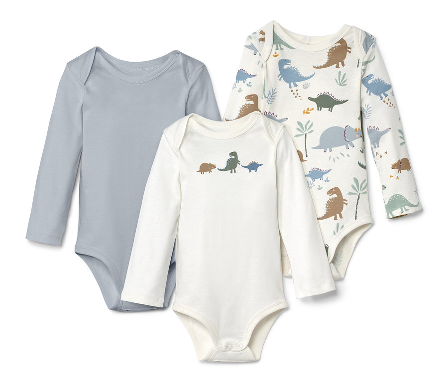 Drei Langarmbodys, einer grau, einer weiß mit Dinosaurier-Print und einer weiß mit Dinosauriern.