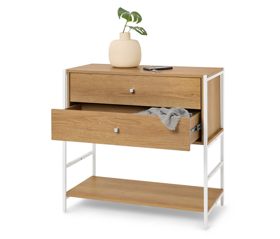 Kommode mit zwei Schubladen, wobei die obere geschlossen und die untere leicht geöffnet ist, auf der Oberseite befinden sich eine Vase mit einer Pflanze, ein Handy und ein Schlüssel.