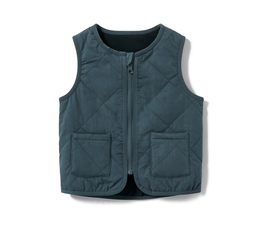 Eine blaue Kinder-Wendesteppweste mit Reißverschluss und Taschen.