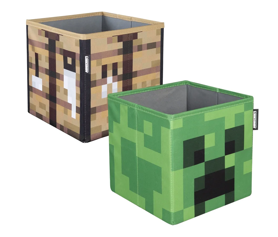 Zwei Minecraft Aufbewahrungsboxen im Pixeldesign: eine mit Werkbank- und eine mit Creeper-Motiv.