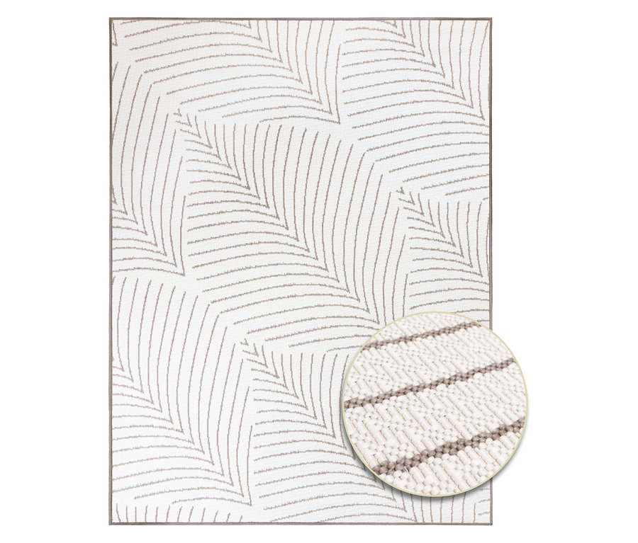 Ein cremefarbener Teppich mit einem grauen geometrischen Blattmuster.