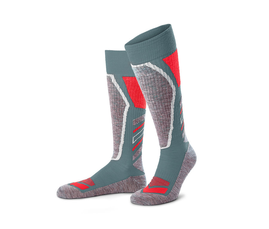 Ein Paar graue Thermo-Skisocken mit Wolle und roten und weißen Details.