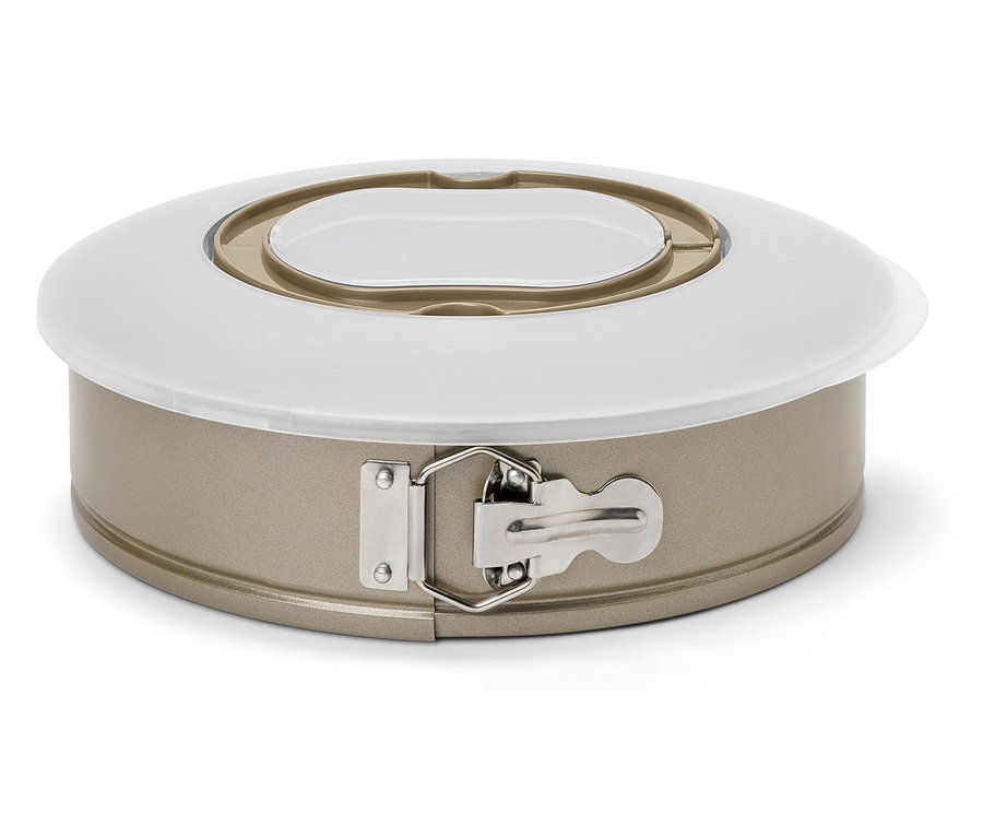 Detail einer goldenen Springform mit weißem Deckel.