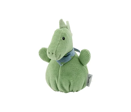 Ein hellgrünes Cord-Plüschtier in Form eines sitzenden Dinosauriers oder Drachen, mit einem blau gemusterten Halstuch.