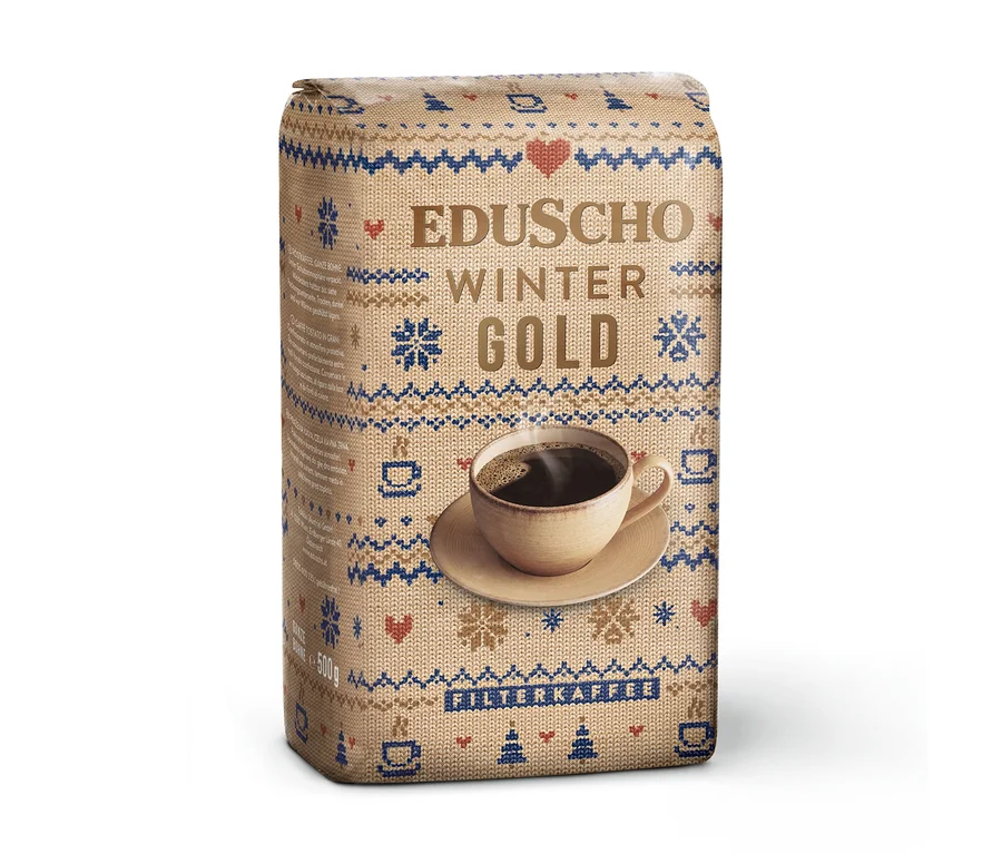 500g Packung EDUSCHO Wiener Gold Ltd. Winter Edition Ganze Bohne, mit beigem Strickmuster, blauen und roten Wintermotiven und einer Kaffeetasse.