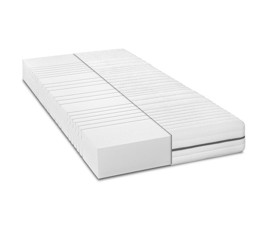 Nahaufnahme einer weißen Badenia 7-Zonen-Komfortschaummatratze, bei der die innere Schaumstruktur sichtbar ist.