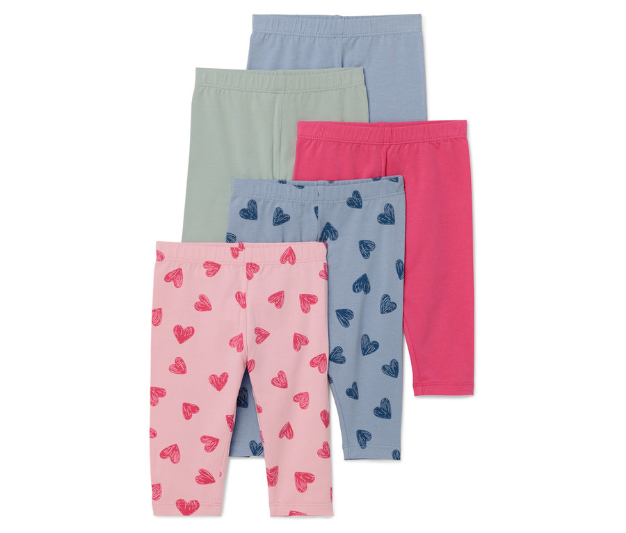 Fünf Paar Kinder Leggings in hellblau, grün, pink, blau mit Herzen und rosa mit Herzen.