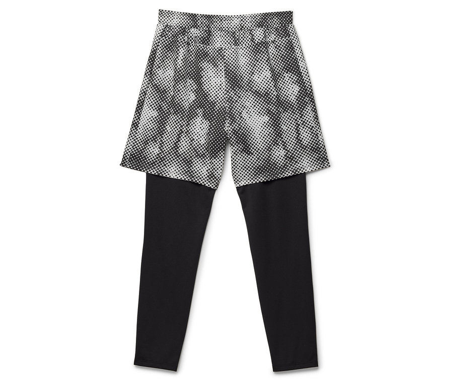 Schwarze Leggings mit darüberliegendem Rock mit Punkmuster.
