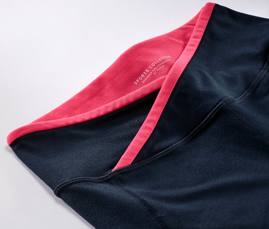 Detail einer Sporttight mit rosa Saum.